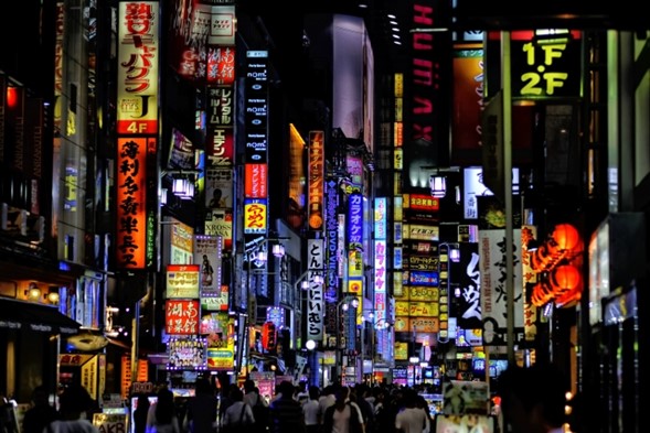 The crowded street of Kabukicho in Shinjuku at night. 

