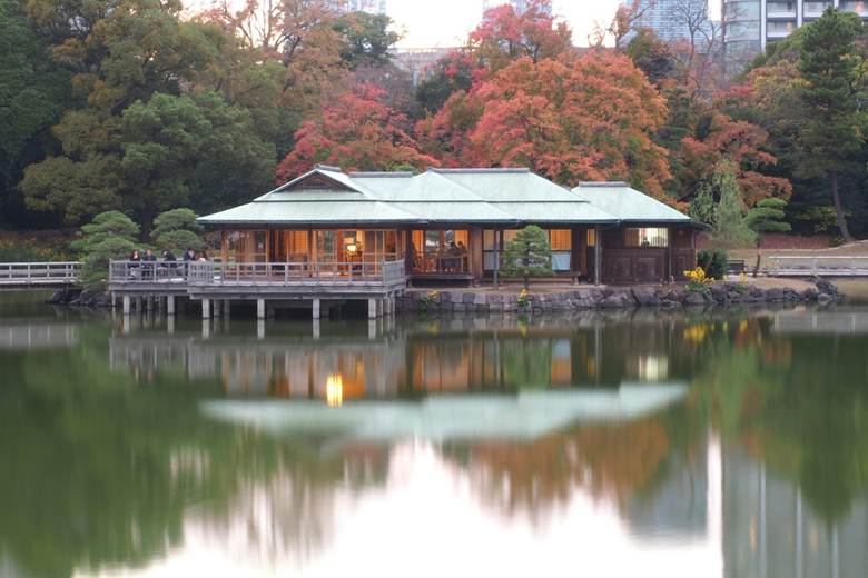 The Nakajima Teahouse sits over a lake.