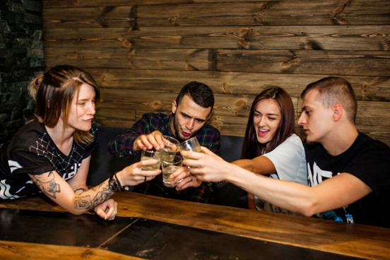 Friends toasting at a bar