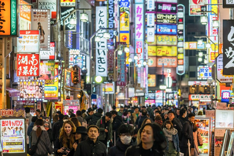 A bustling street with neon signs in Shinjuku