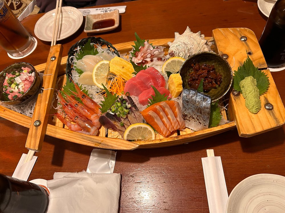 sashimi on a wooden ship served
